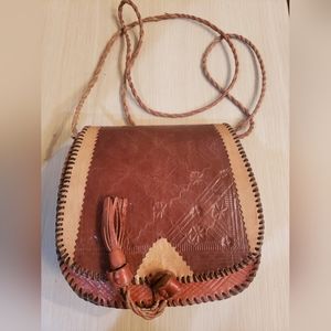 Hand made brown leather bag, in good condition. Size is 7 x 7.5 x 2.5.
